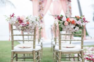 Wedding ceremony floral pieces for chairs