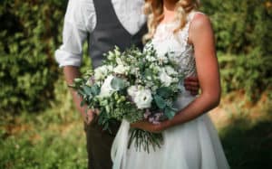 Wedding bouquet in the hands of the bride.