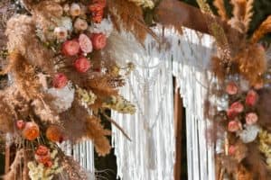 Beautiful unusual boho chic wedding arch for ceremony