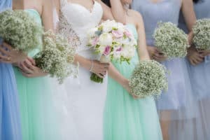 Bride and bridesmaids in sea green and blue